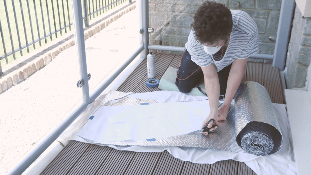 Cutting the foil insulation using the template