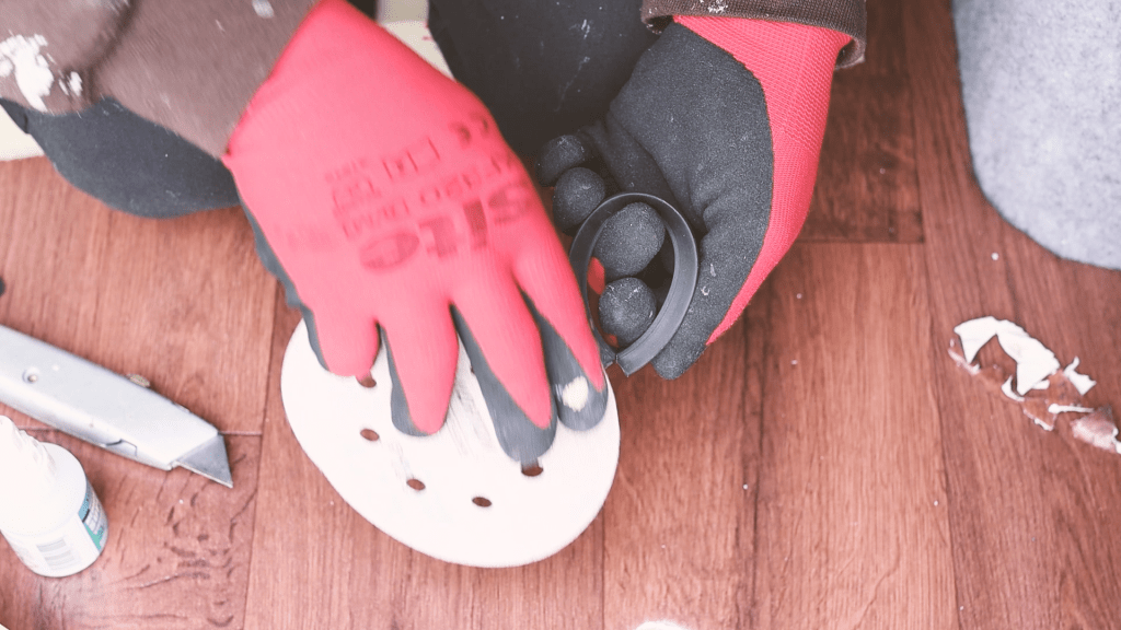 Sanding the glue off the rubber