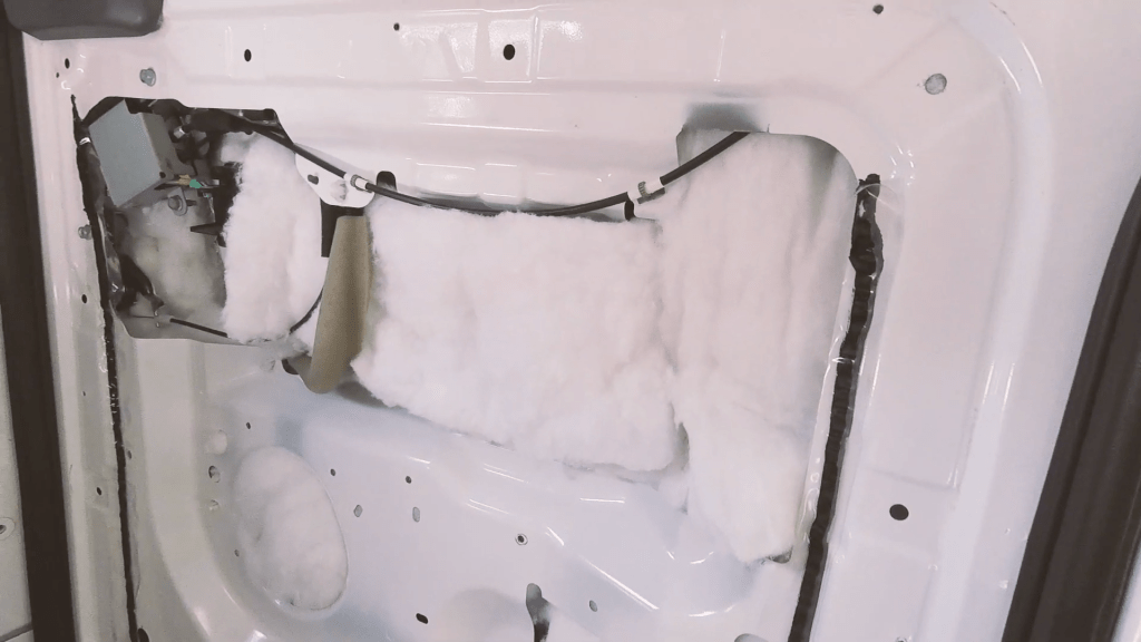 Van door panel filled with plastic loft insulation