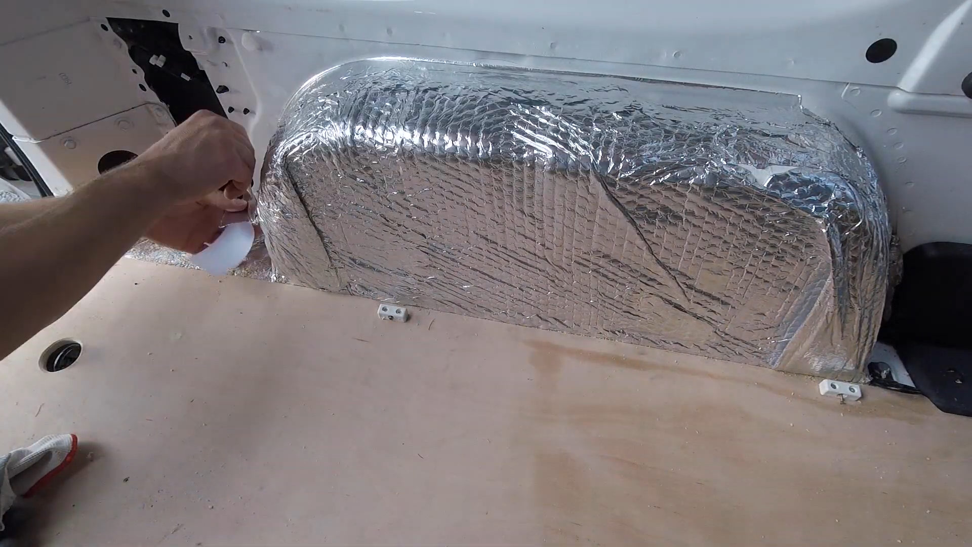 Wheel arch covered with Thermawrap foil bubblewrap insulation