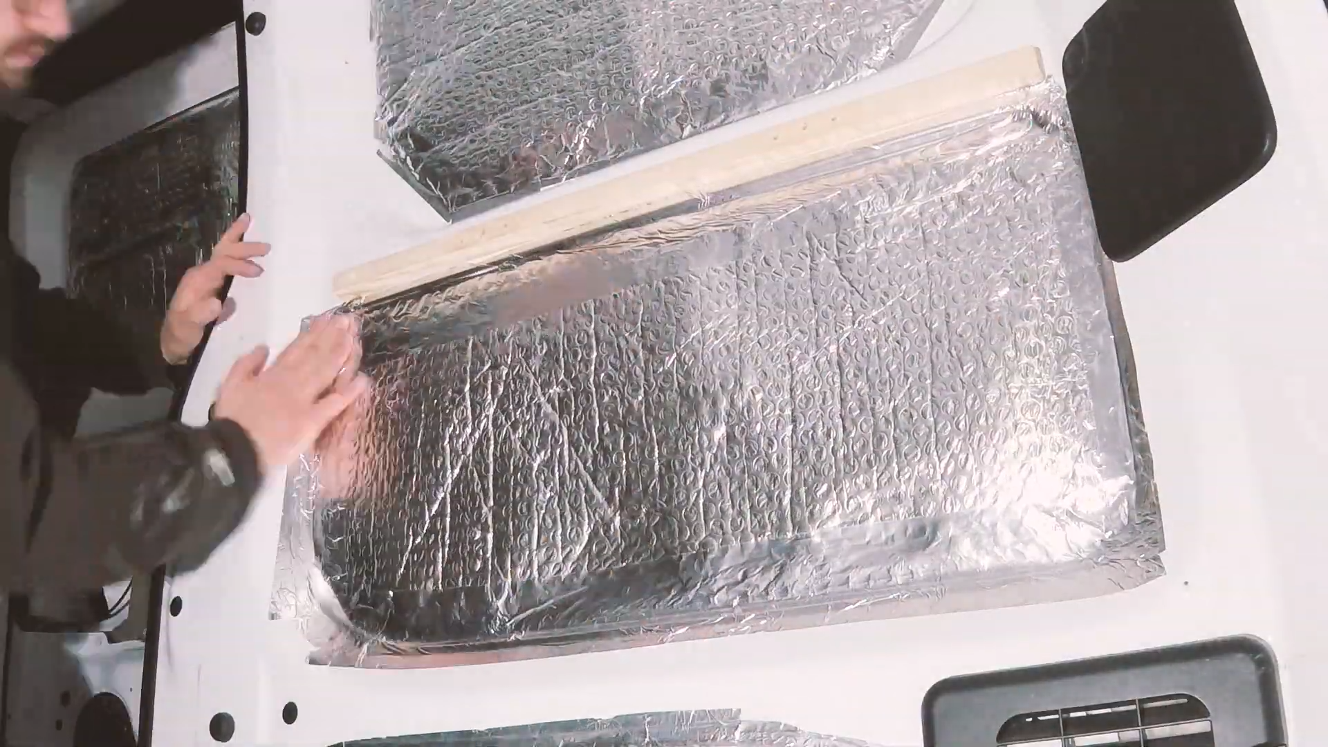 Van wall cavity covered with foil bubblewrap insulation