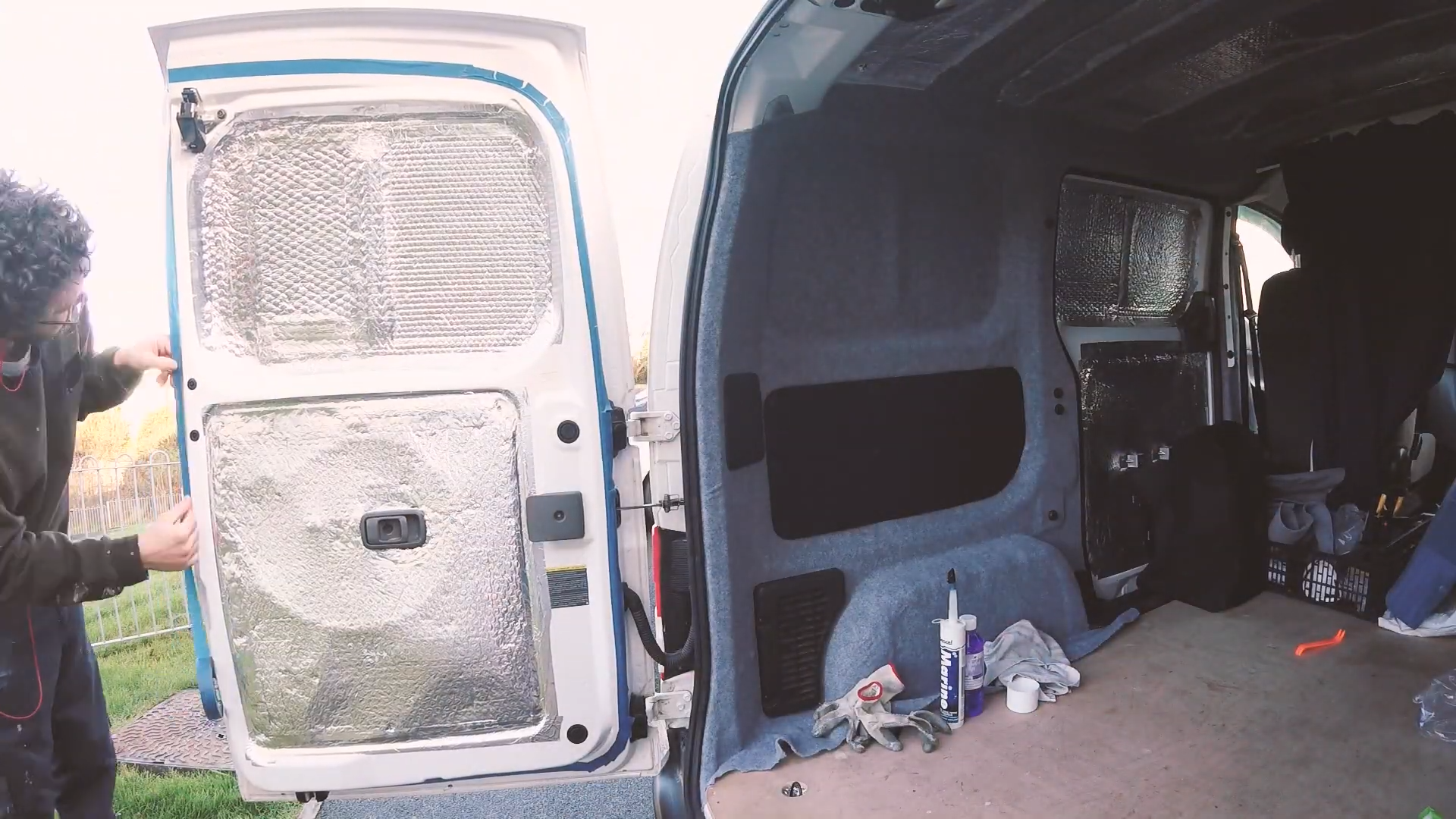 Taping off the back doors with masking tape