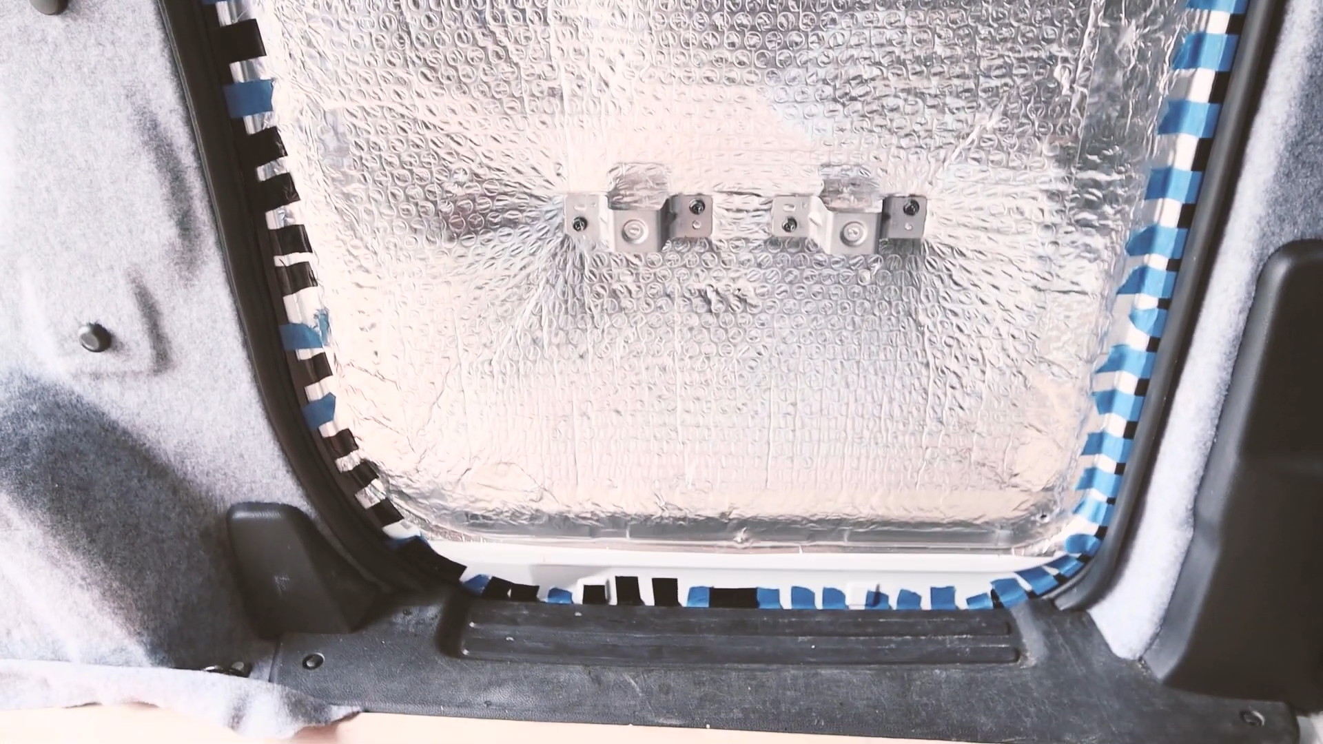 The rubber edge taped and stuck to the side door