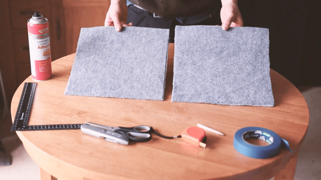 Two rectangles of smoke-grey carpet