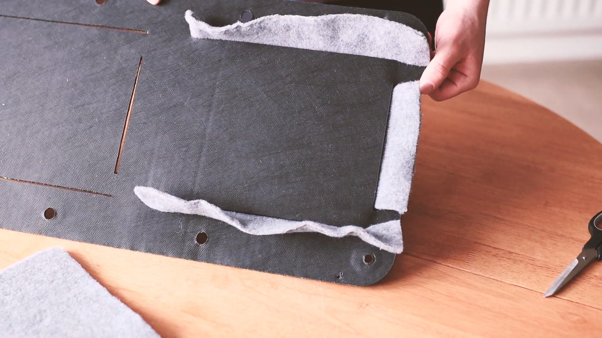 Door card with the pocket inserted through the slots