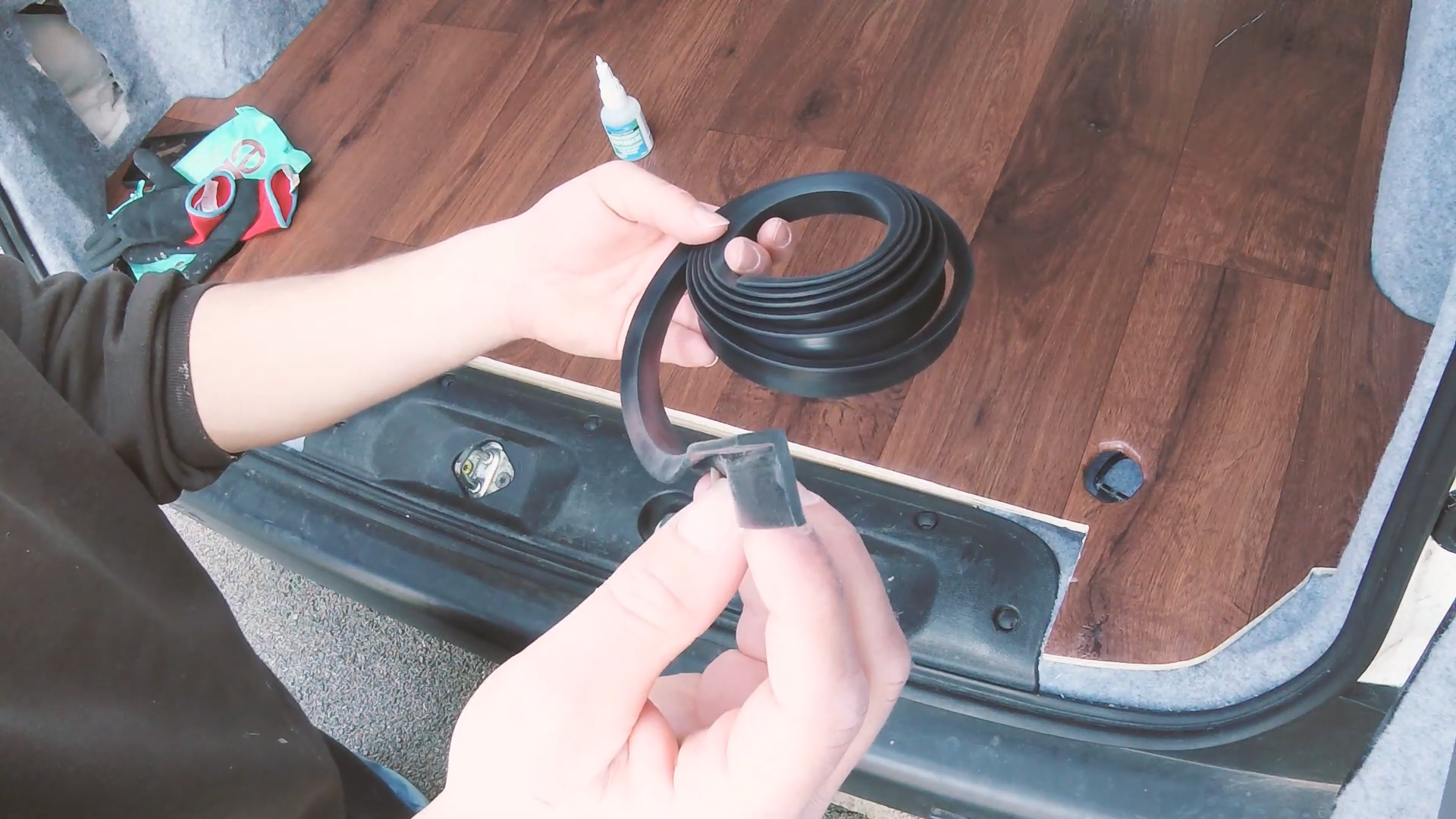 A coil of black rubber L-section trim