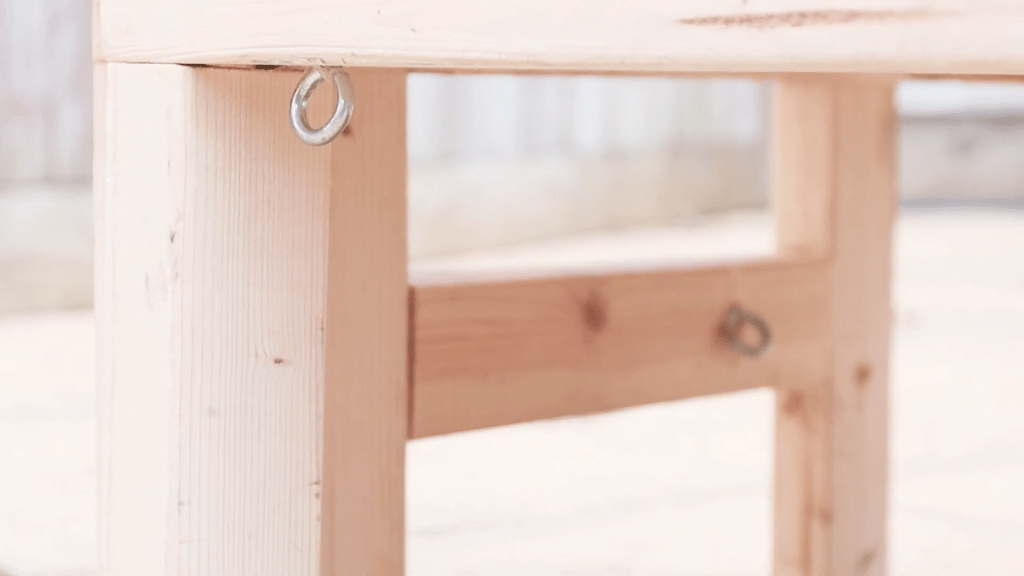 Close up of a metal eye fixed underneath the bed
