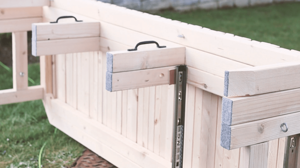 Side view of the van bed showing carpeted feet of the bed legs