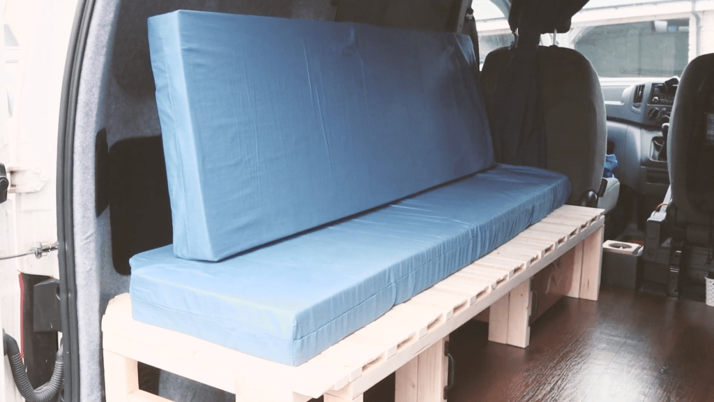 The first and second mattress sitting on the van bed