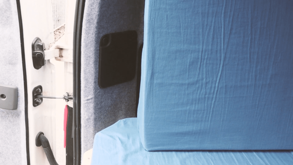 The shorter second mattress on top of the longer first mattress