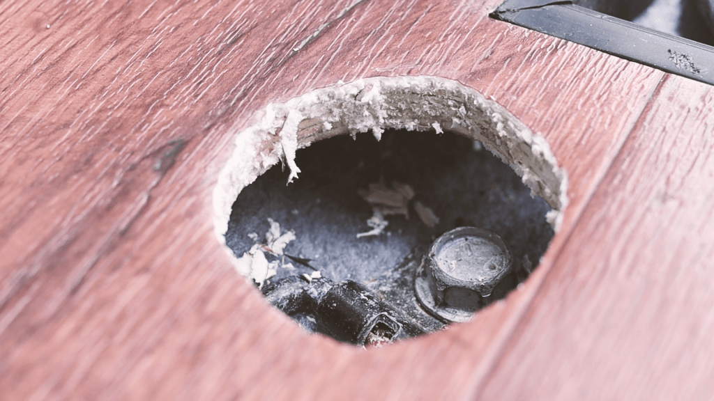 The hole after the vinyl edges have been cut off