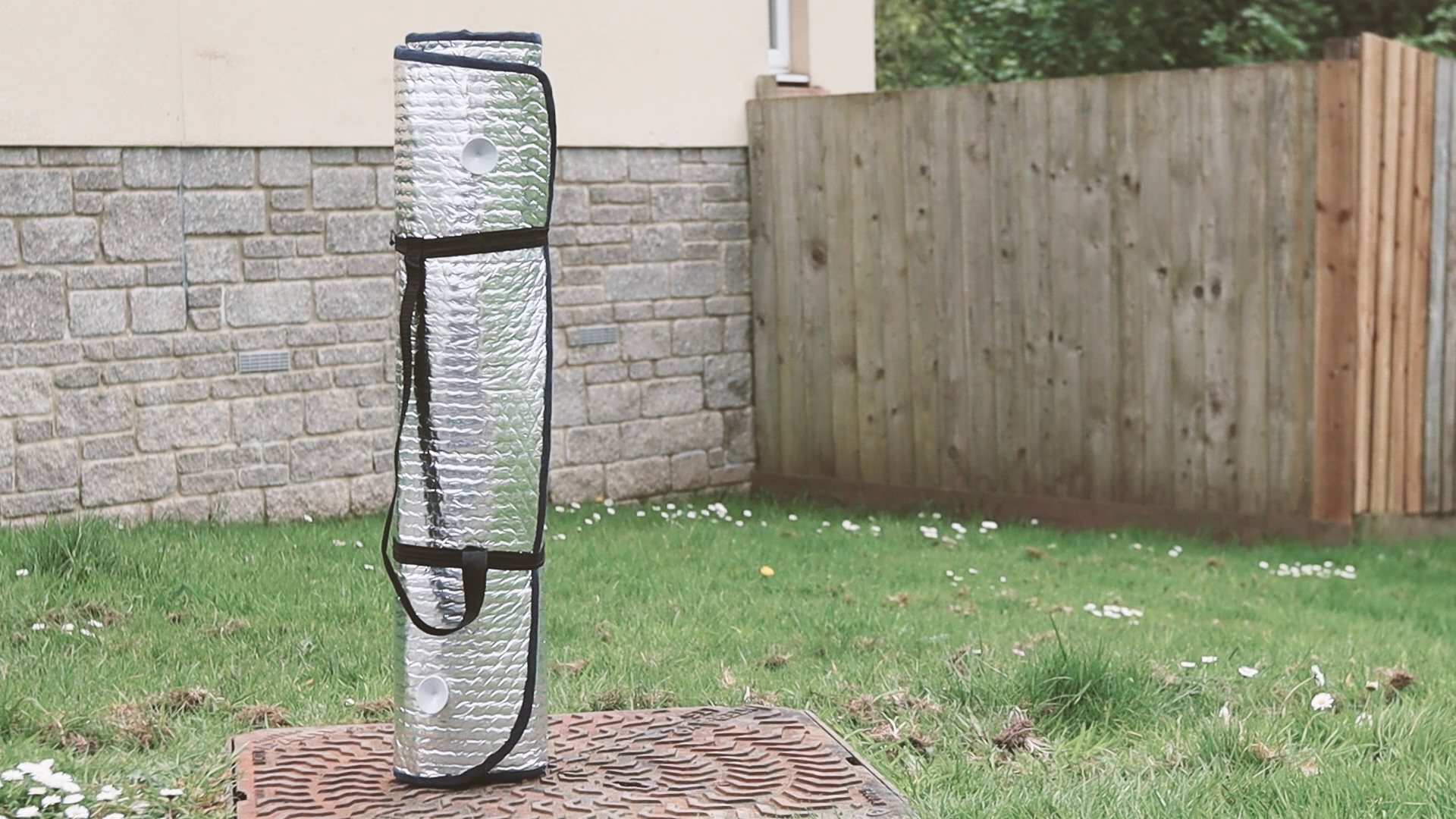 The rolled up thermal blackout windscreen cover