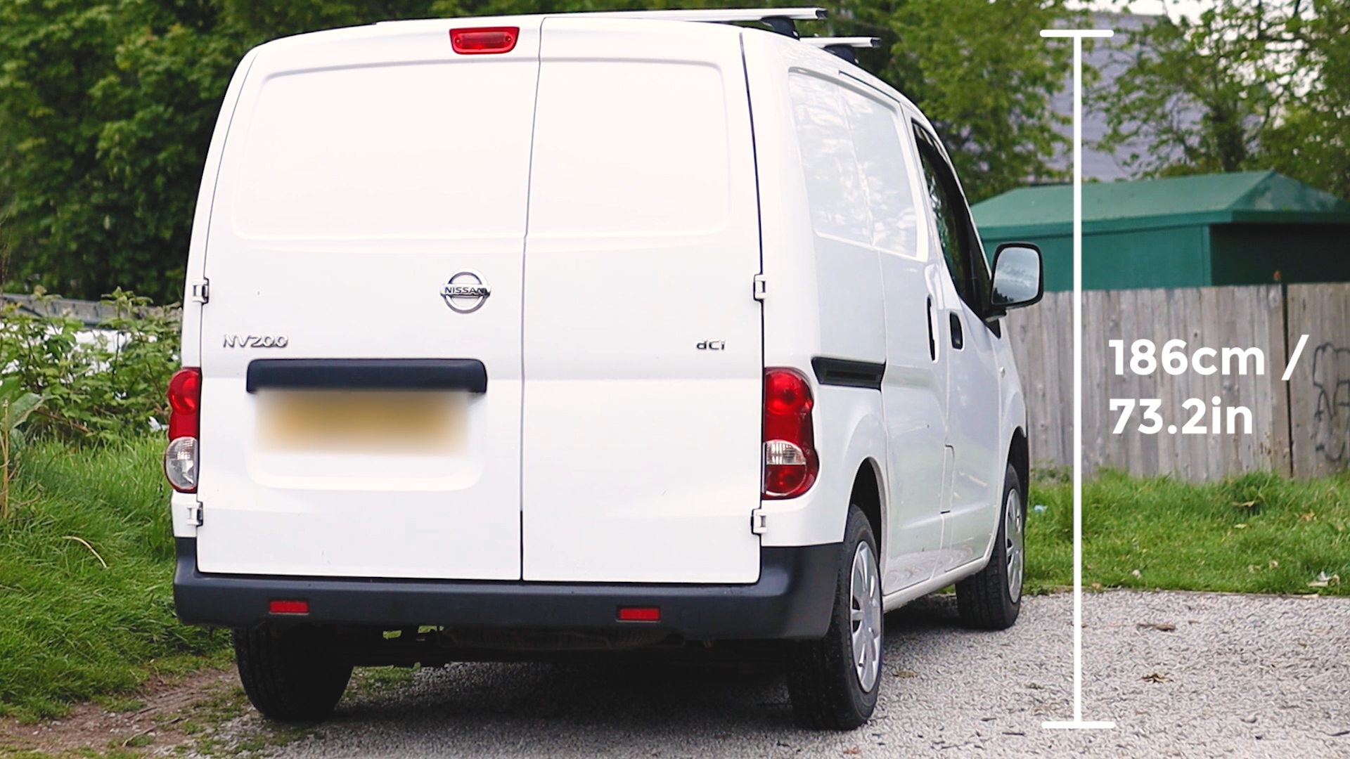 A Nissan NV200 from behind with height measurements