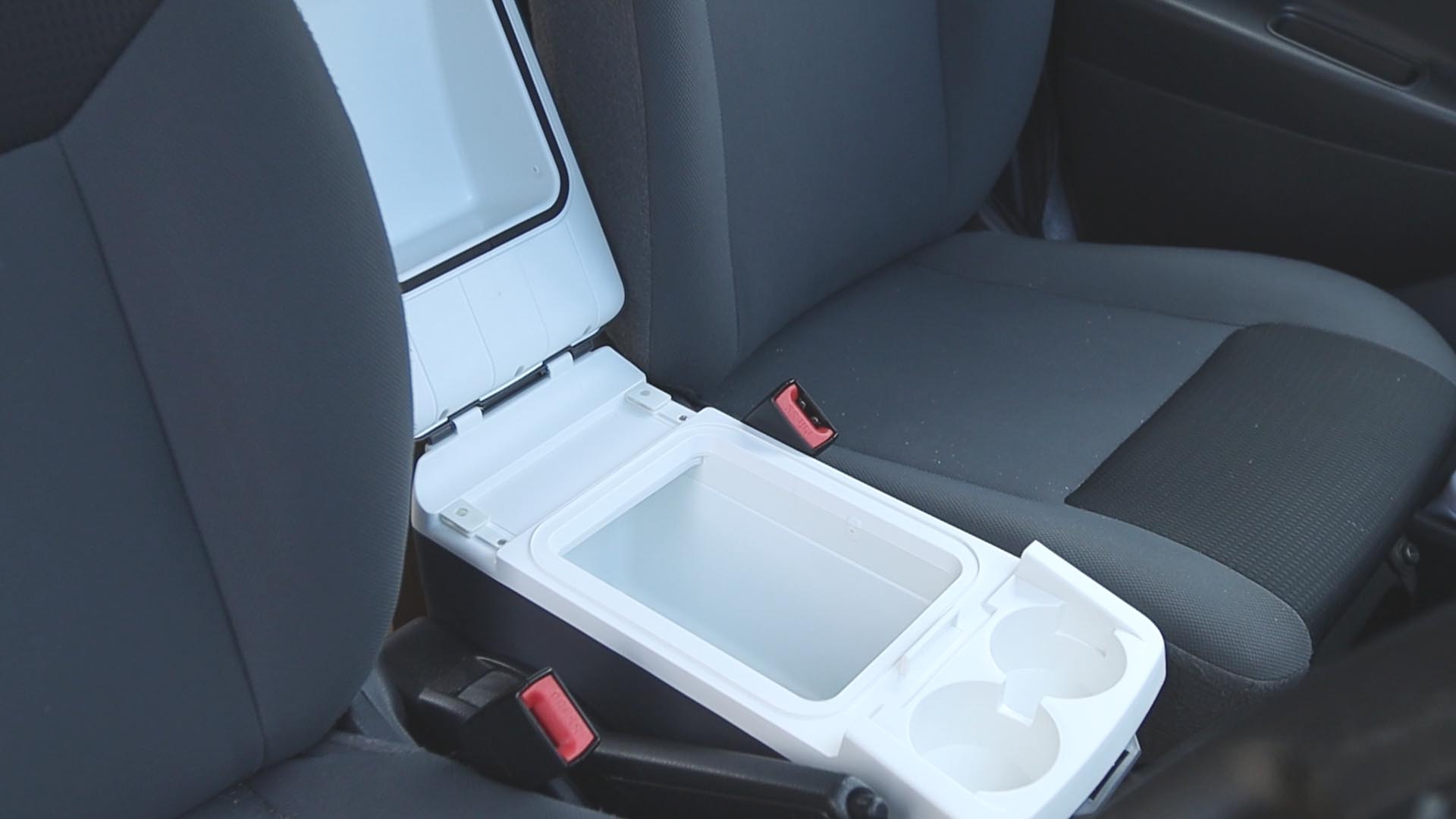 An open Halfords 8 litre 12v electric cool box in a Nissan NV200