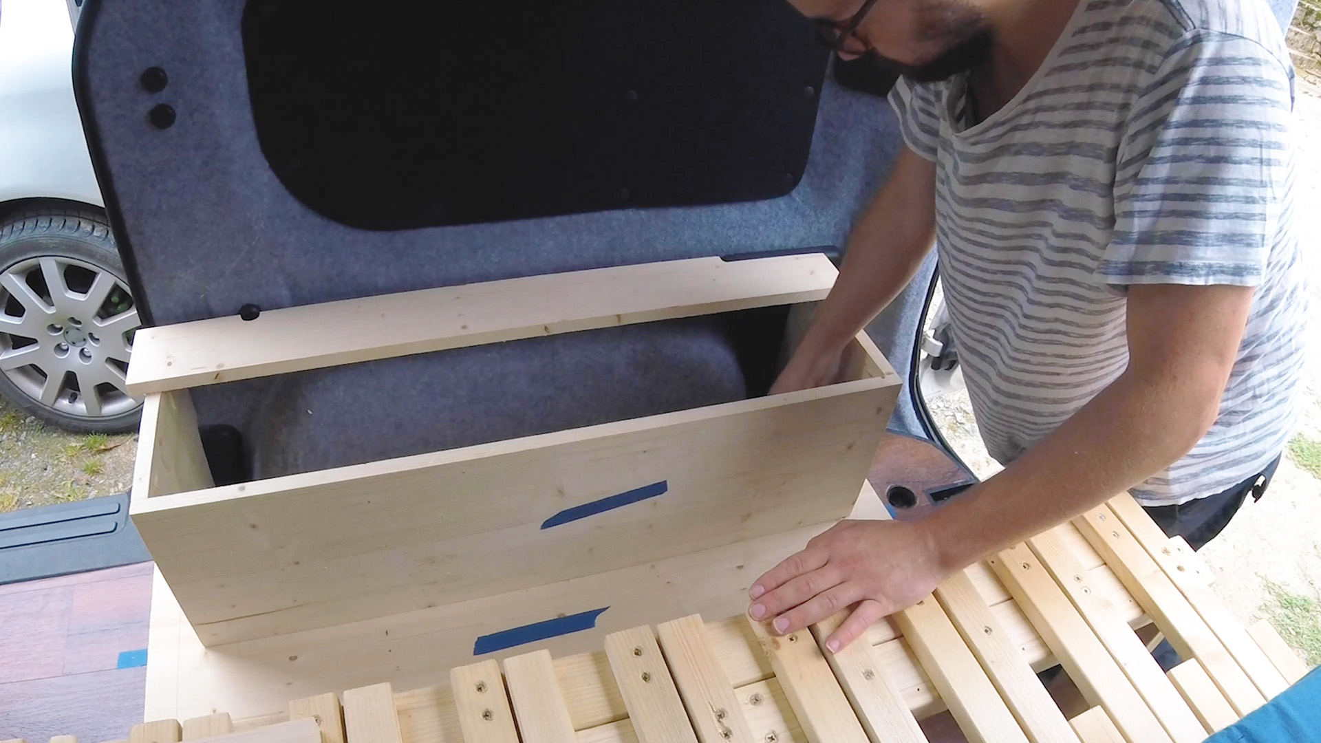 Marking where to cut the base so it fits around the wheel arch of the van