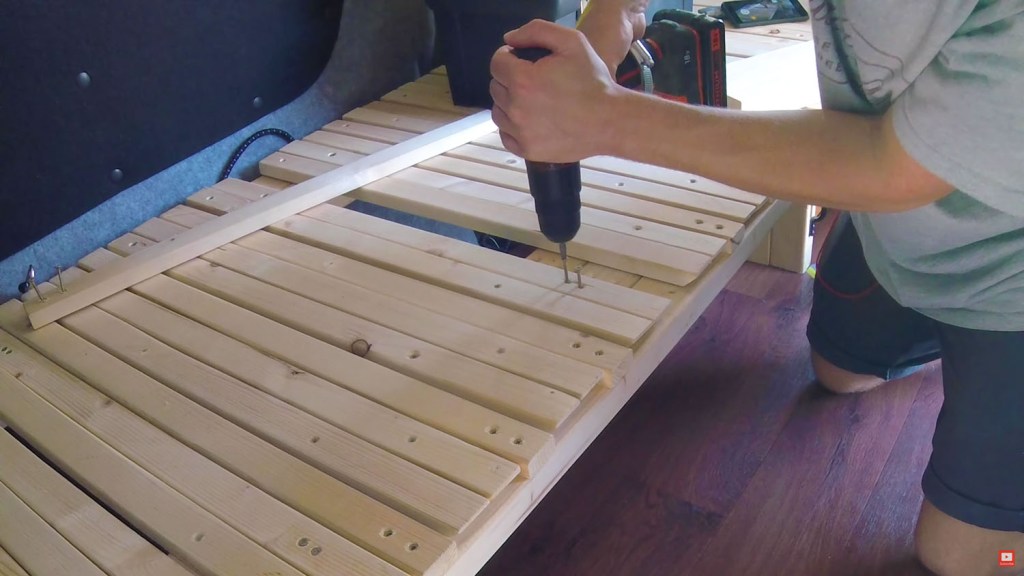 Unscrewing and removing a second van bed slat