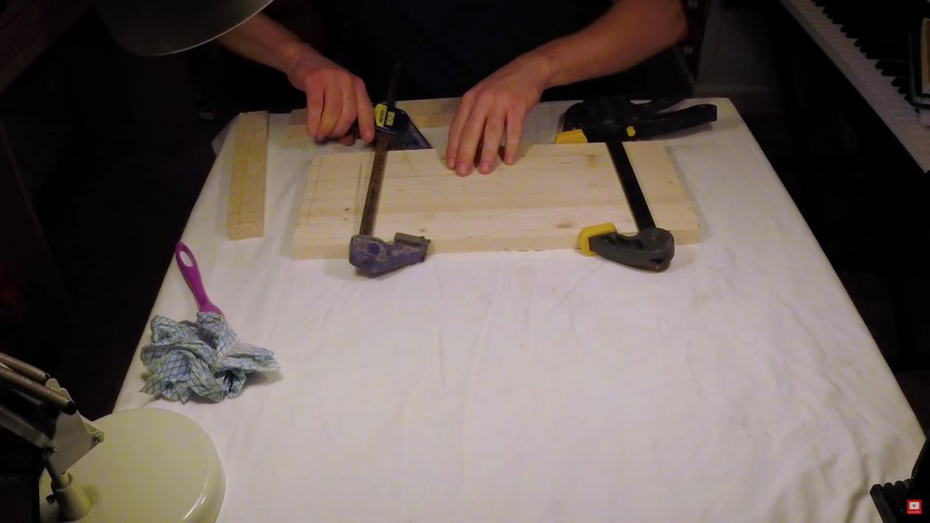 Clamping the glued wood while it dries