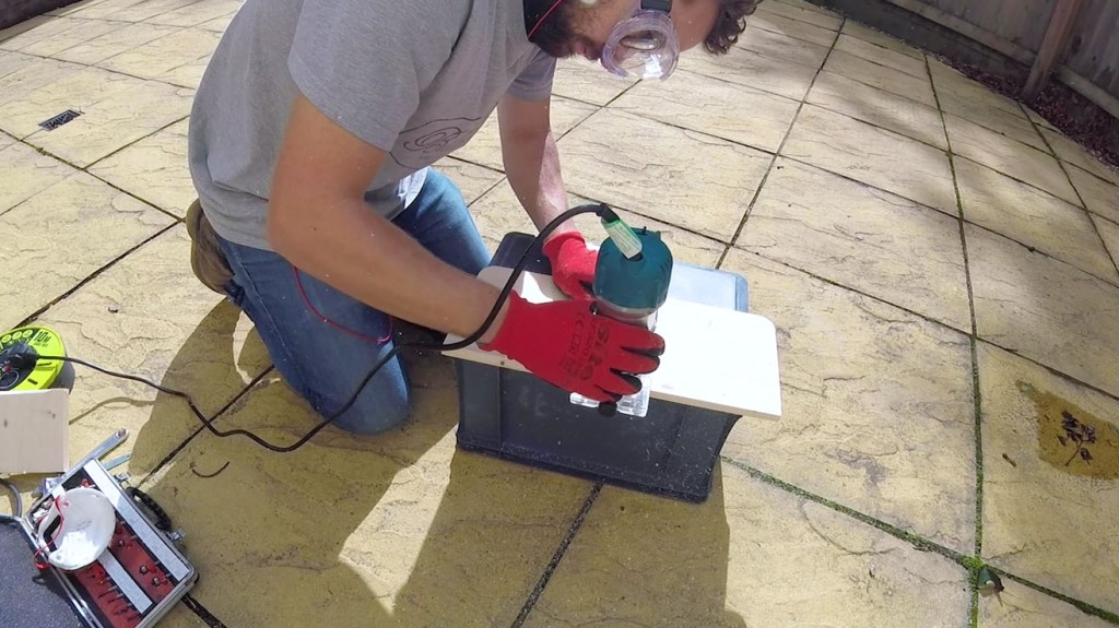 Rounding the edges of the wood board with a router
