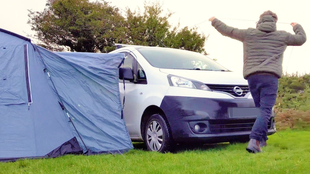 Pulling guy ropes over the van