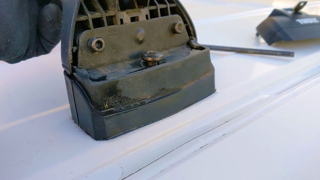 Removing the roof bars from the van