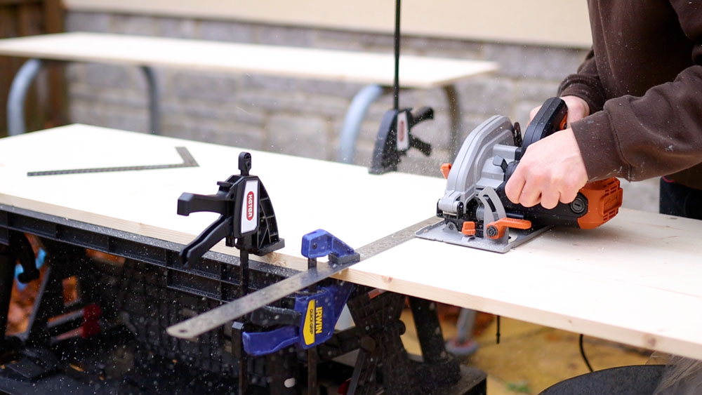 Cutting the pine furniture board with a circular saw