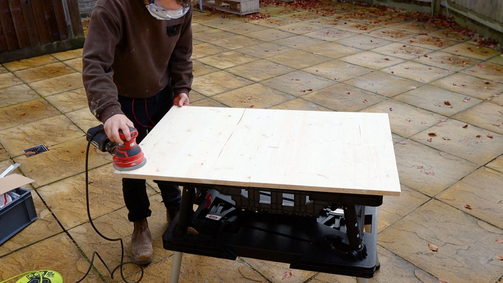 Sanding the joined front pieces of wood