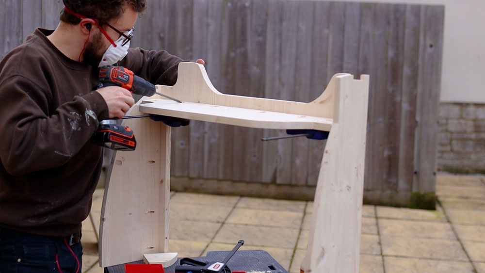 Screwing the top shelf in with pocket holes