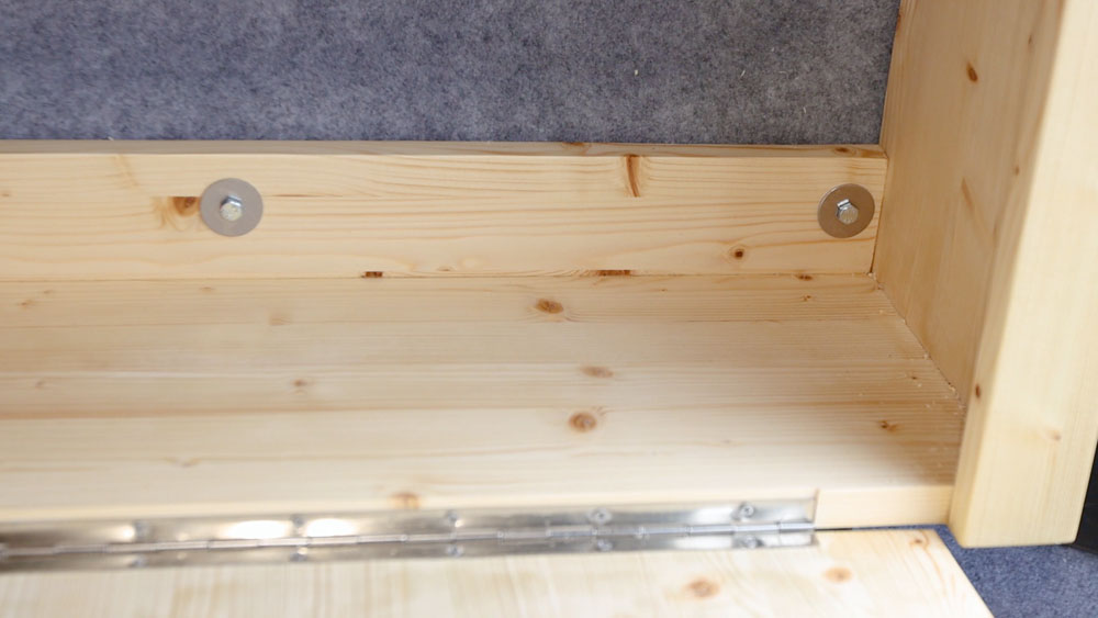 Table unit bolted onto a van wall