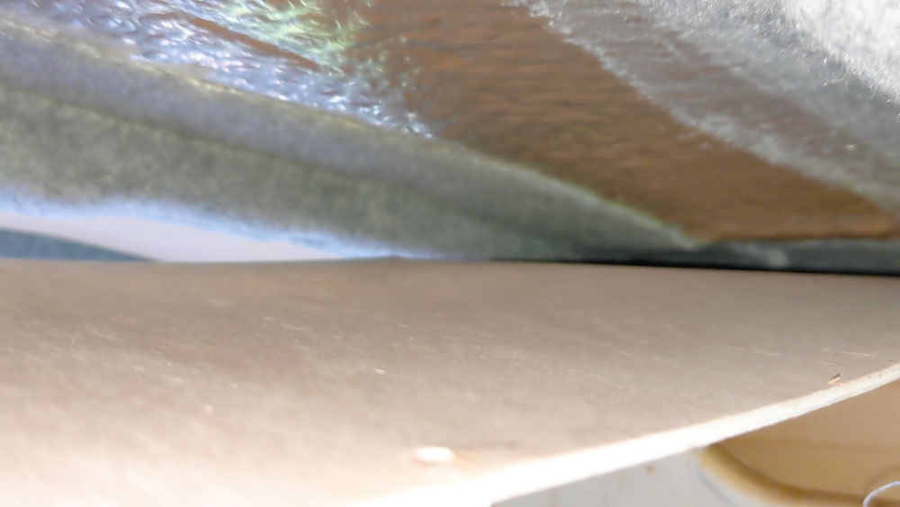 Foil insulation and plywood on a van ceiling