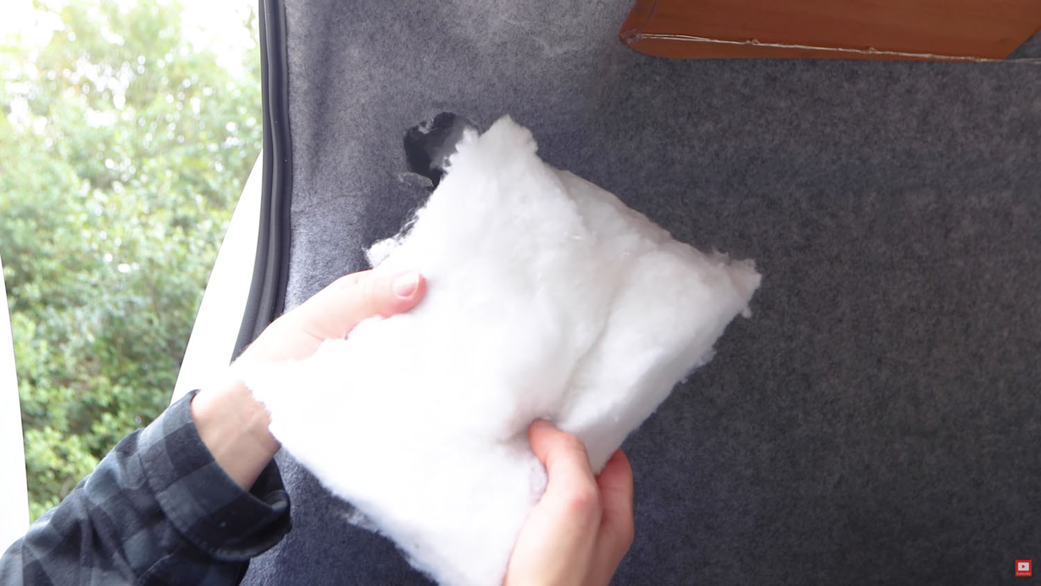 Recycled plastic bottle from the rear wall column of the van