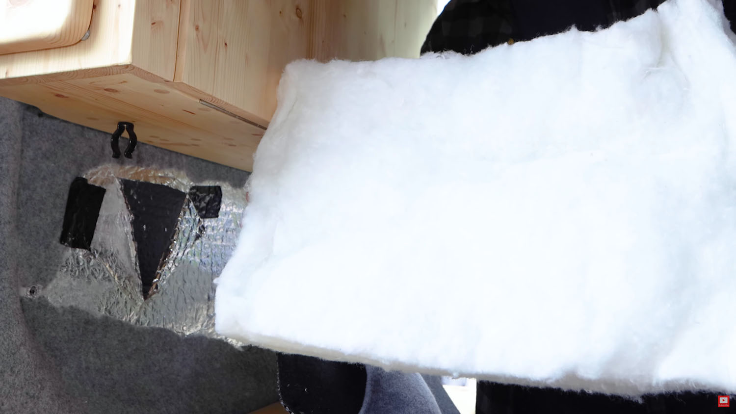 Recycled plastic bottle insulation from the van wall cavity