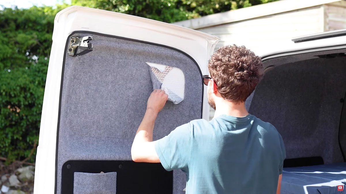 Exposing and checking the foil insulation for the first time since the van was carpeted