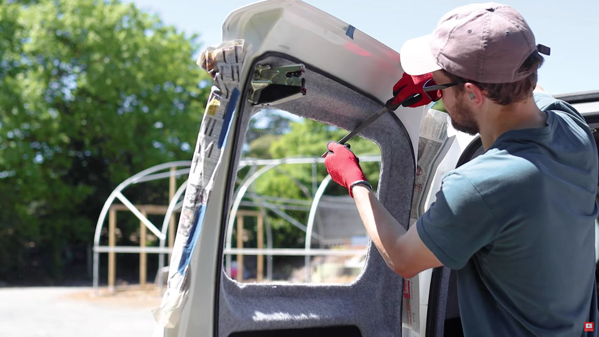 Filing the cut edges of the van door