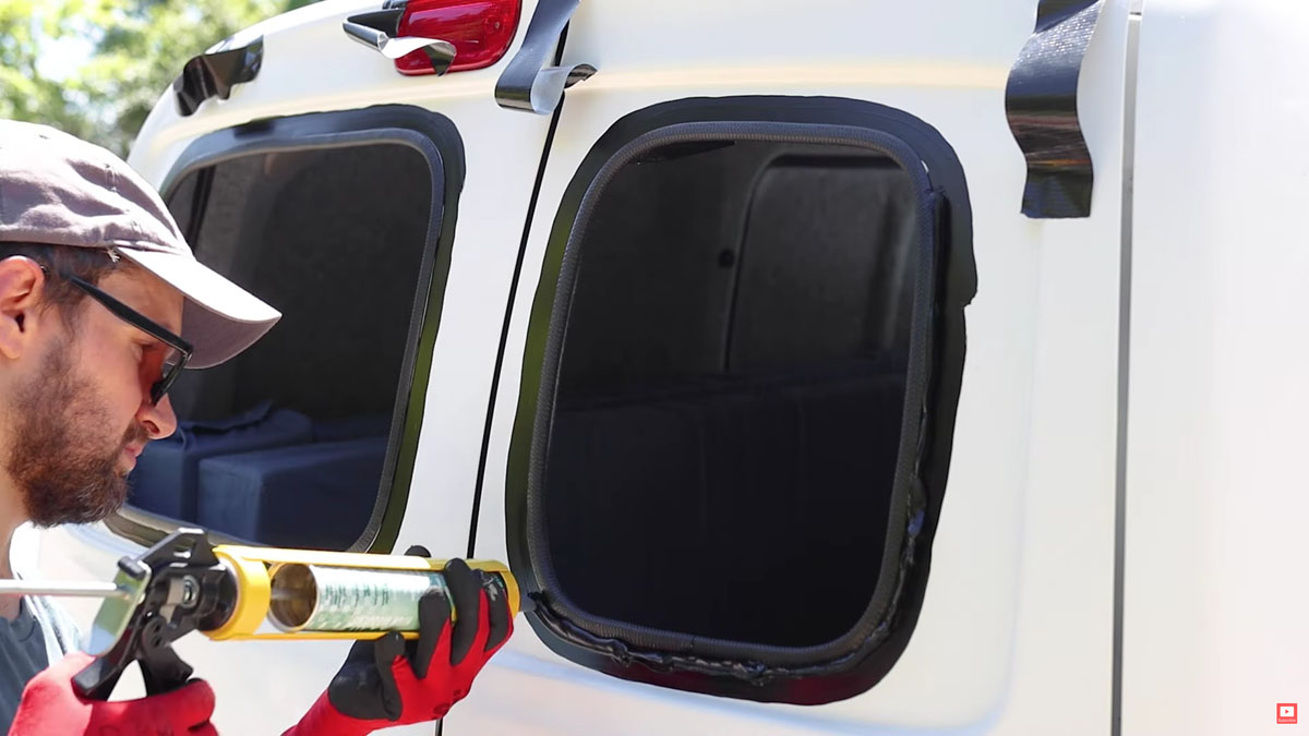 Applying the adhesive to the van