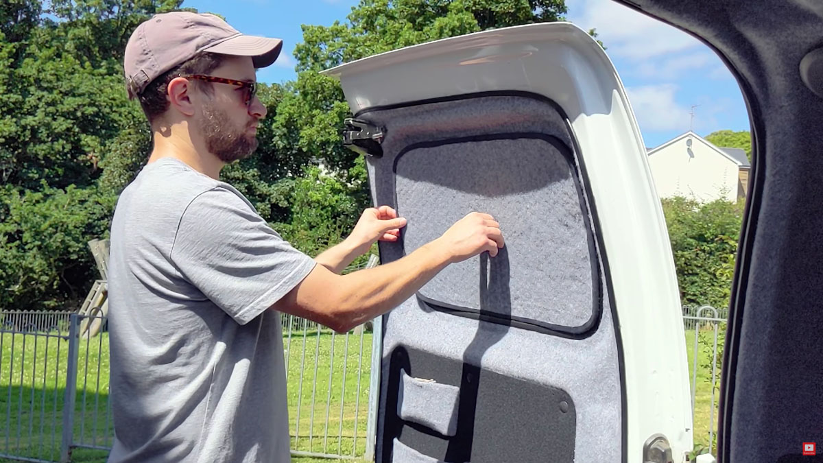 Attaching the thermal window cover to the van window