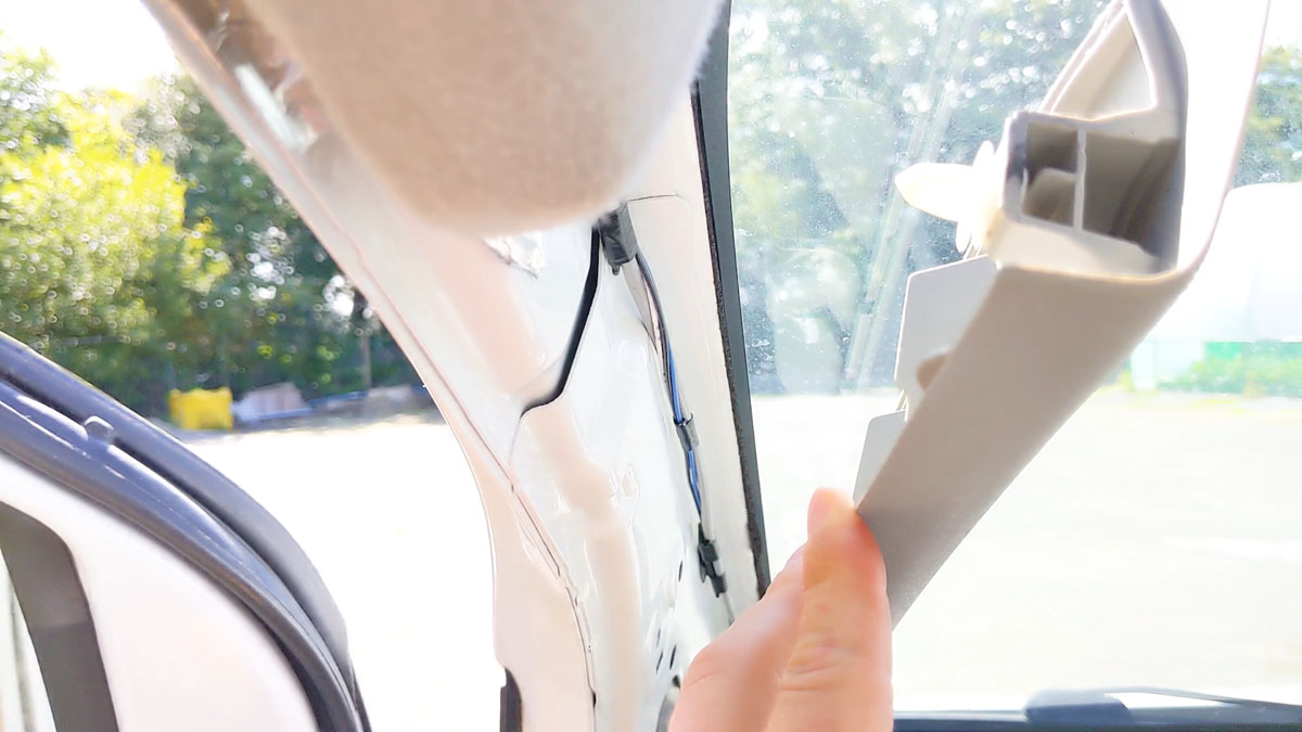 Inside the Nissan NV200 passenger side door column trim