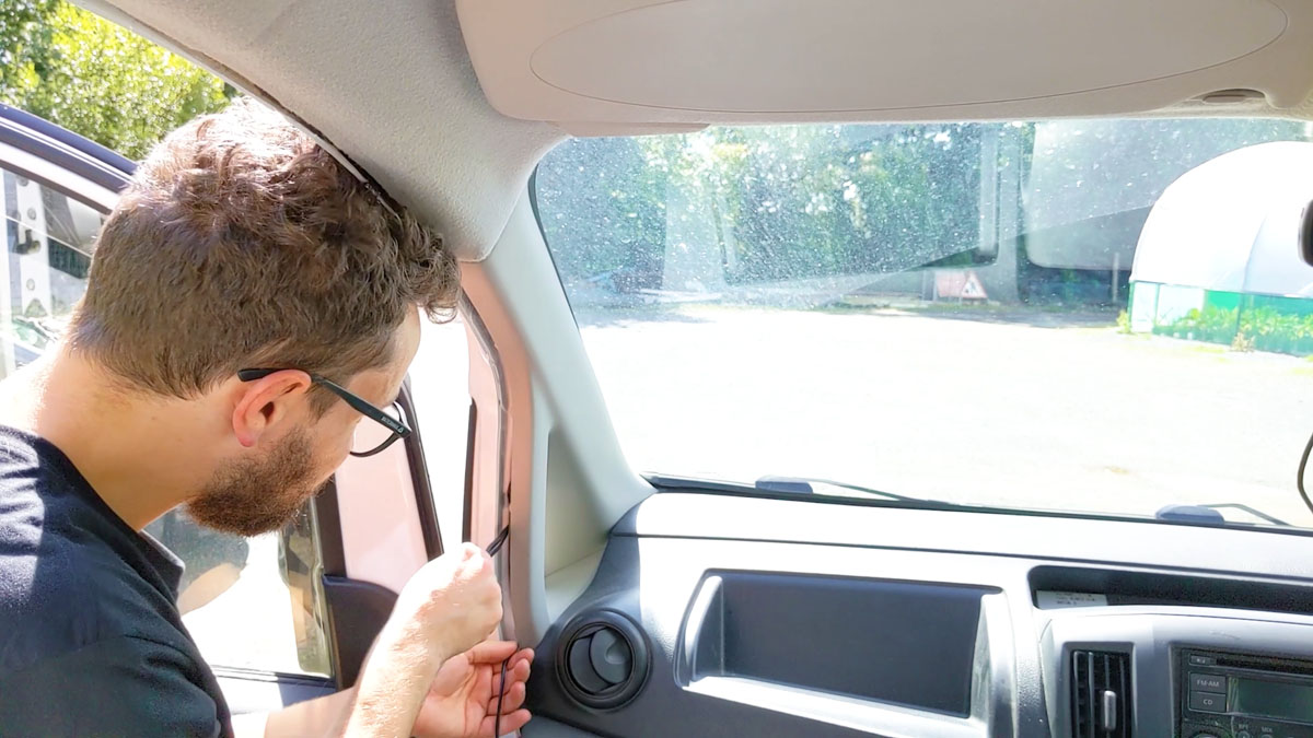 Routing the dash cam cables through the passenger side door column