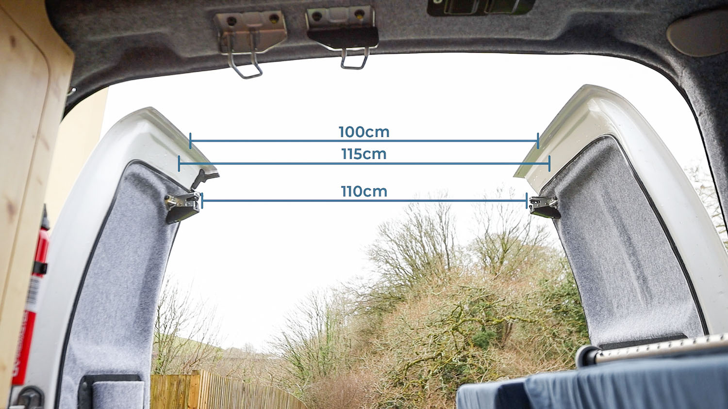 The measurements between the open back doors of a Nissan NV200 van