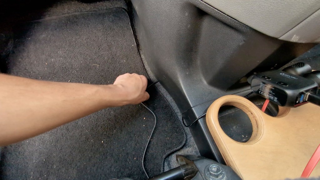 Hiding the reversing camera cable under dashboard trim