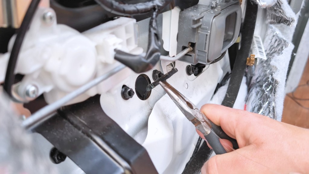 Pulling the reversing camera connector into the door cavity