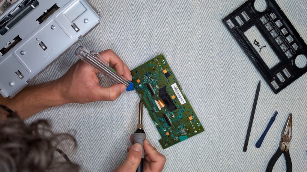 Resoldering the clips on the Nissan Daewoo circuit board