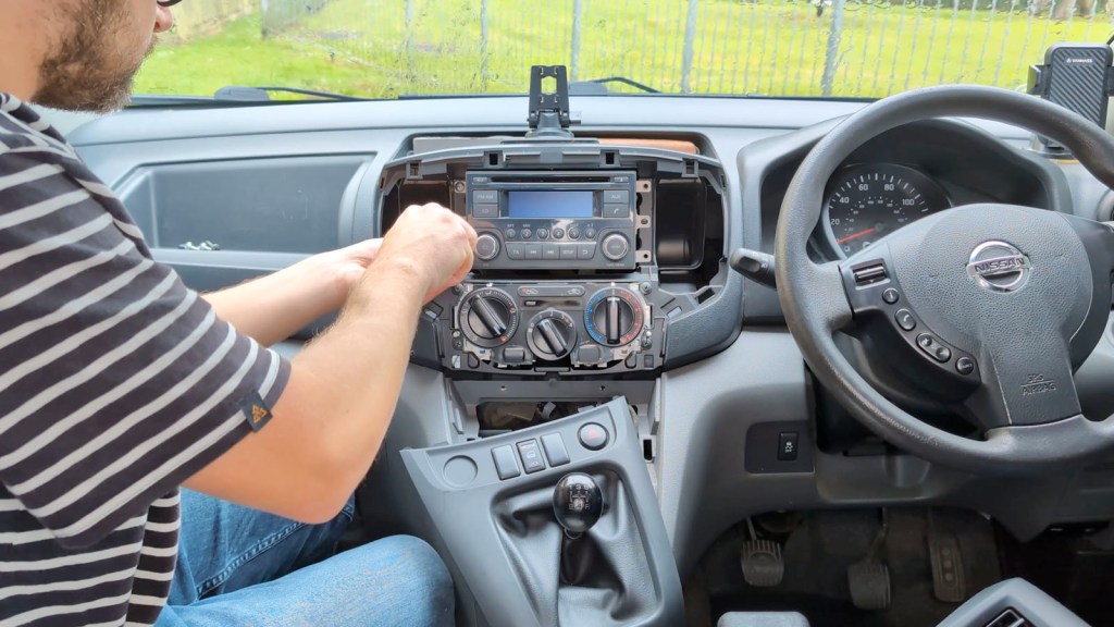 Screwing in the Nissan Daewoo head unit