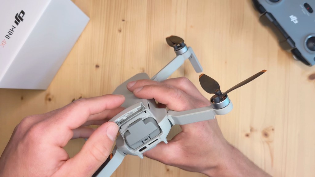 The battery compartment of the DJI Mini 4k Camera Drone