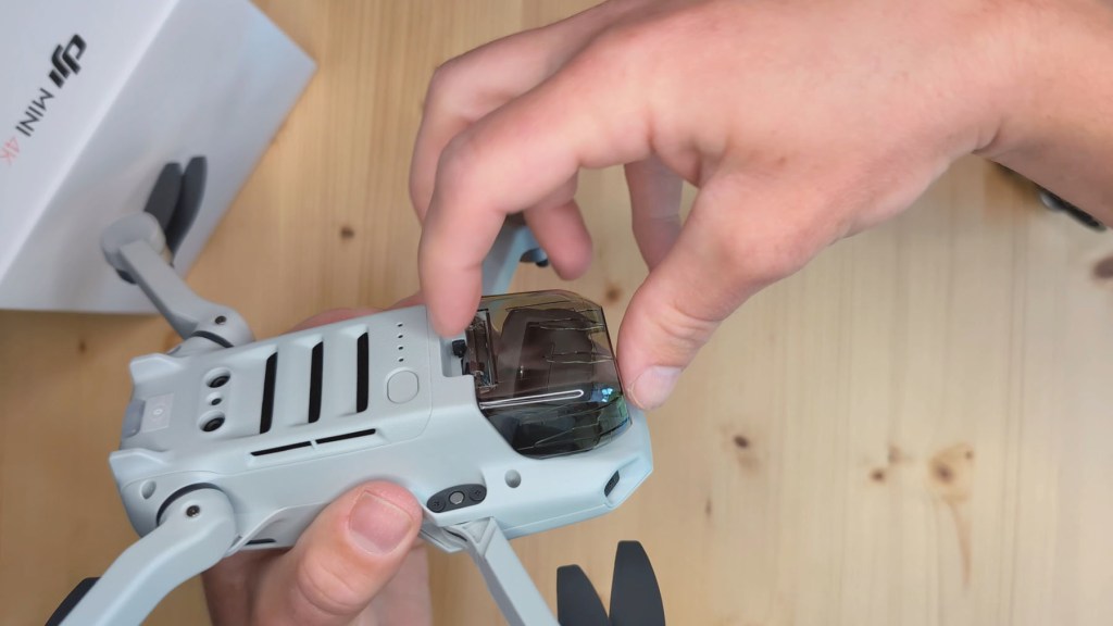 Removing the camera gimbal cover on the DJI Mini 4k Camera Drone