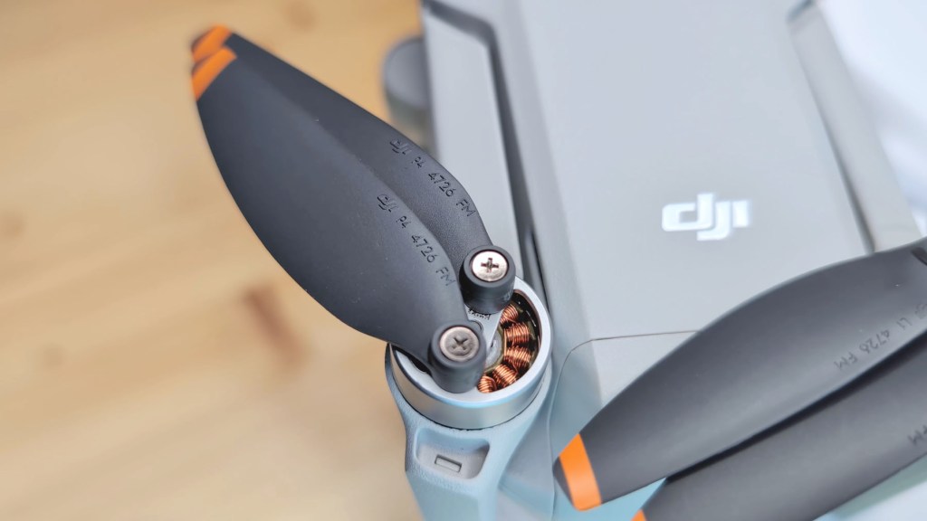 Copper coils on the wings of the The stabilised camera gimbal of the DJI Mini 4k Camera Drone