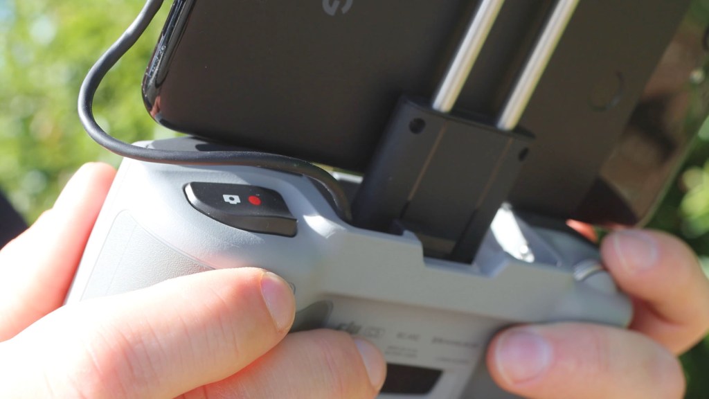 The photo and video capture button on the DJI RC-N1c Remote Control for DJI Mini 4k
