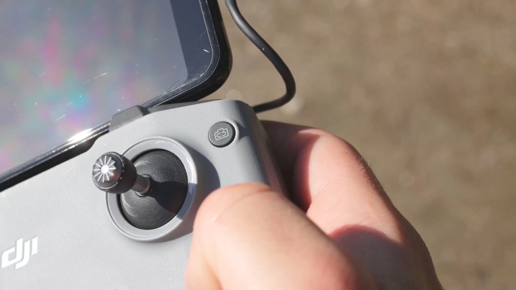 The camera switch rotate button on the Remote Control for DJI Mini 4k