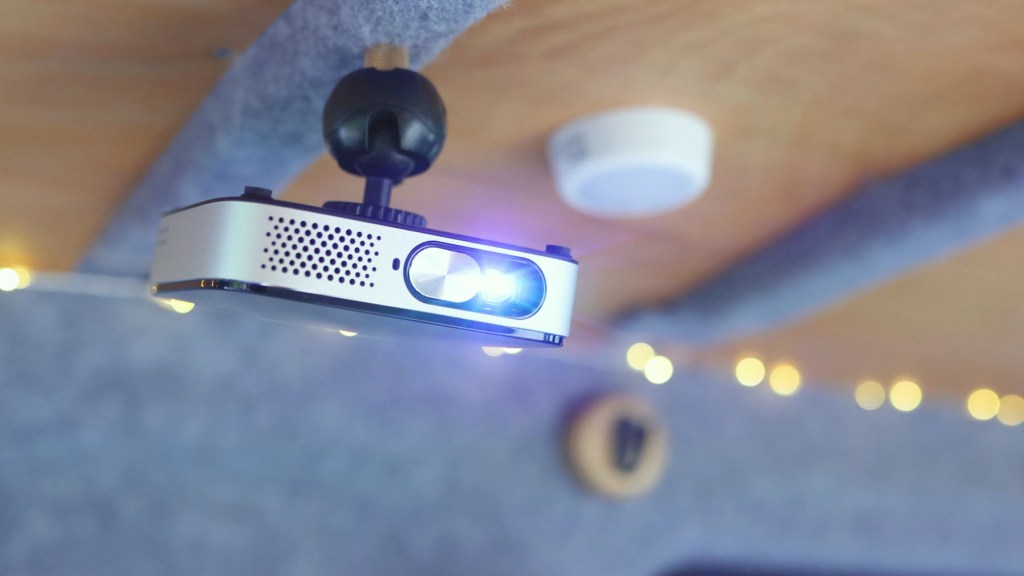 Wimius Q3 Mini Portable Projector installed to the ceiling of a camper van