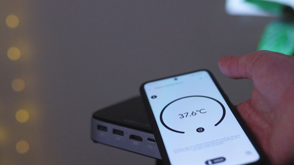 testing the temperature of the Wimius Q3 Battery Projector