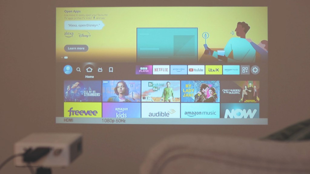 Amazon Fire TV stick homepage on the Akiyo O1 tiny projector